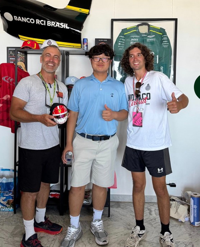 David with a signed Charles Leclerc helmet replica and tour guests